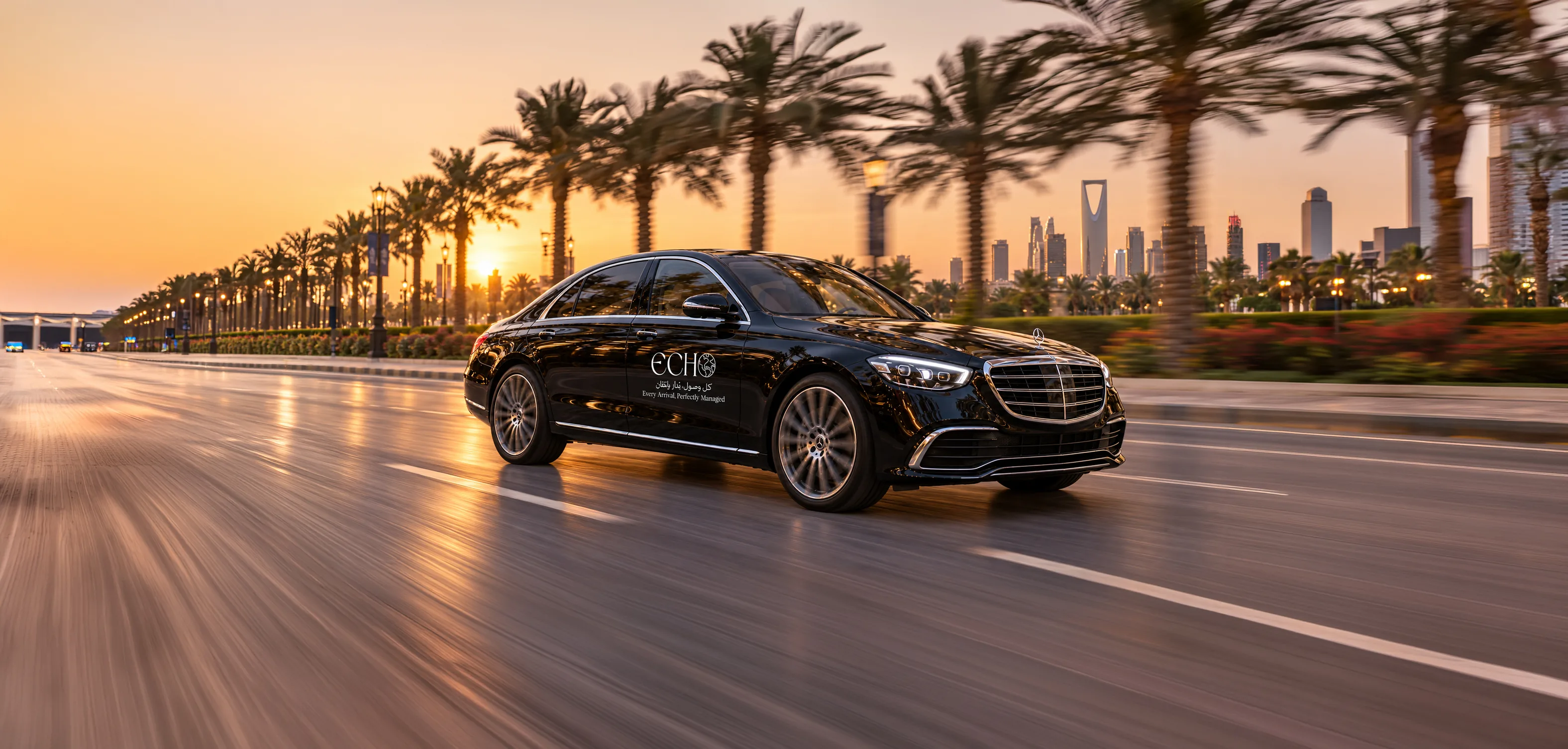 An ECHO chauffeured car on a Riyadh boulevard at sunset, the city skyline behind it